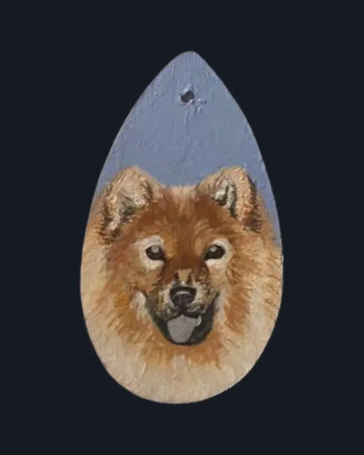 Chow chow hand-painted on a wooden pendant