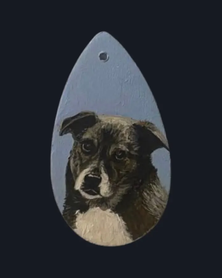 Collie mix hand-painted on a wooden pendant